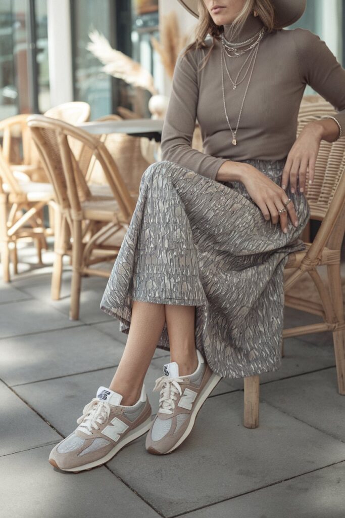 New Balance 327 sneakers add a casual, boho edge to the feminine outfit