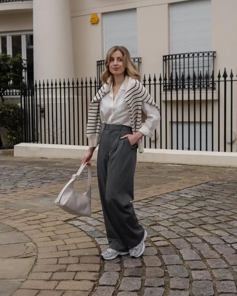 while the light grey New Balance sneakers keep it fresh and functional.