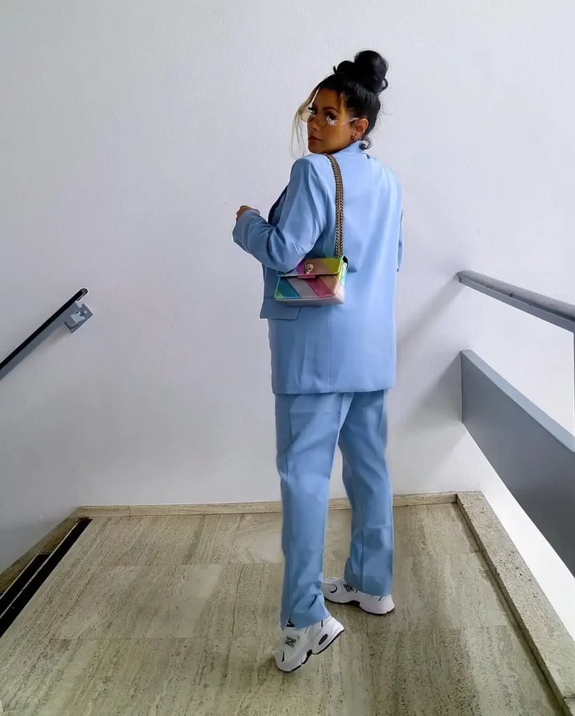 The crisp white New Balance 530 sneakers keep things grounded, functional, and fashion-forward.