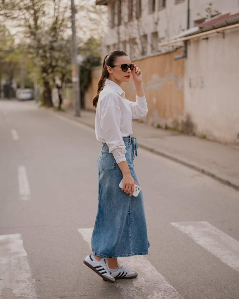 structured denim midi skirt (with jean details like seams and pockets) with a tucked-in white button-up shirt