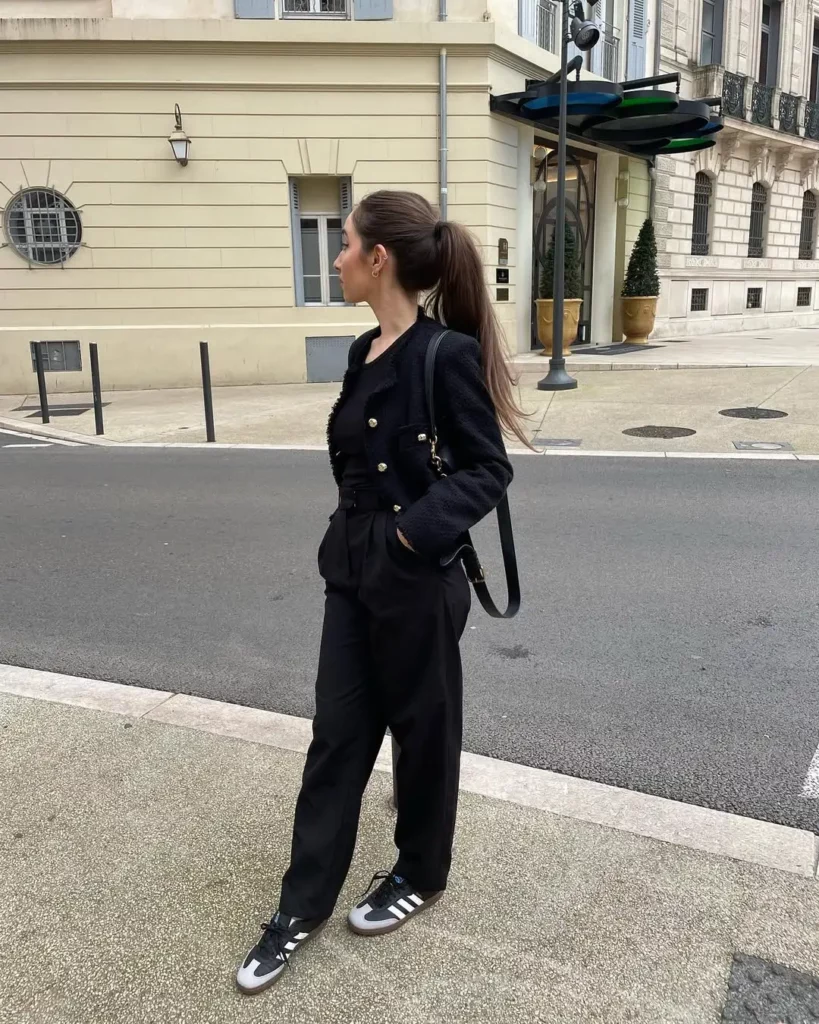 The black Adidas Sambas with suede accents add just the right amount of relaxed contrast without breaking the outfit’s structure.