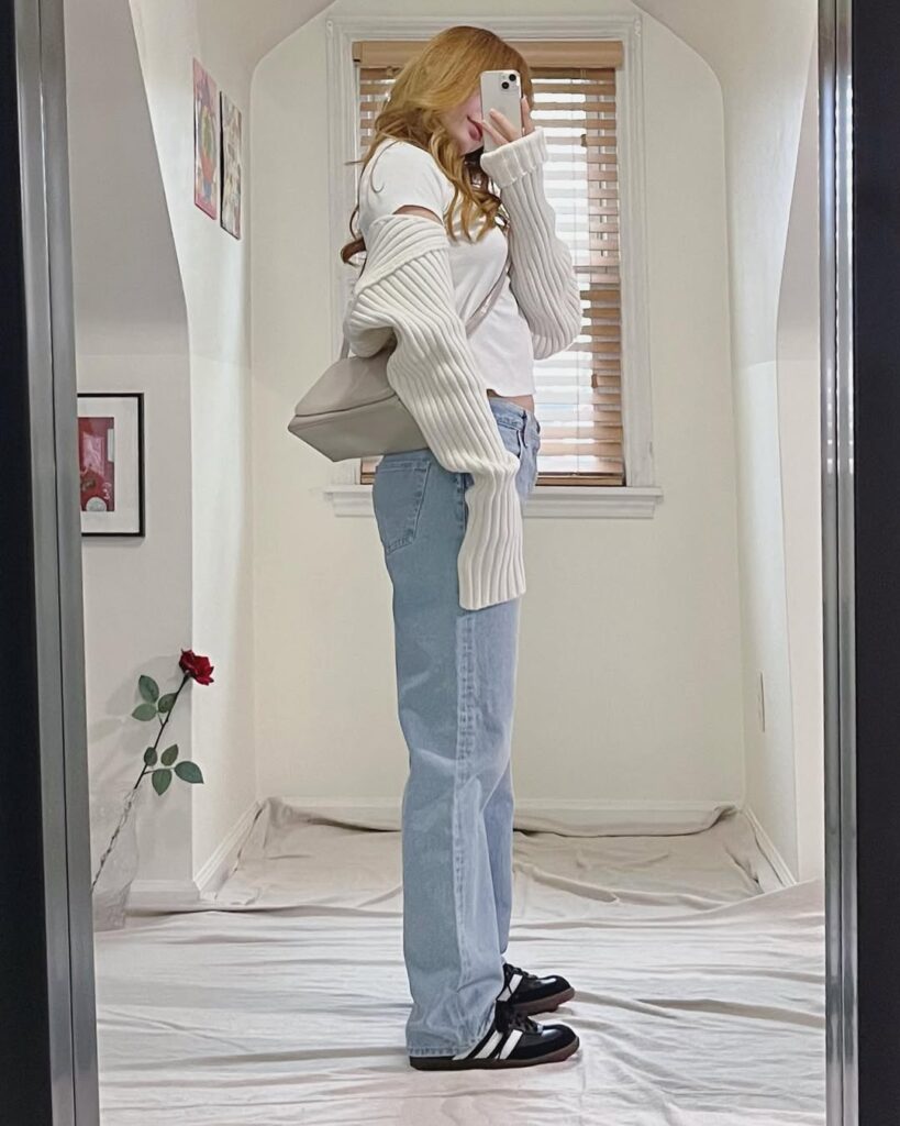 air light-wash straight-leg jeans with a white ribbed knit crop top