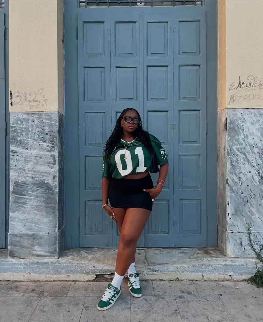 high-waisted shorts and green Adidas Campus 00s