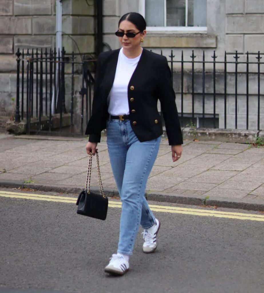 Style a crisp black blazer with sharp gold buttons over a white tee and blue slim-fit jeans. Then break the mold with a surprise sneaker