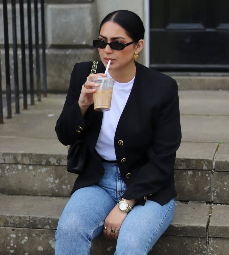 Style a crisp black blazer with sharp gold buttons over a white tee and blue slim-fit jeans. Then break the mold with a surprise sneaker