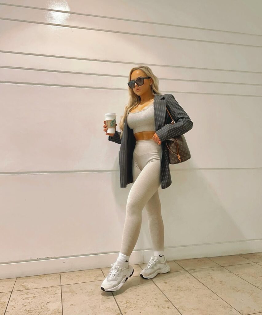 Cream ribbed activewear set + oversized pinstripe blazer + white Ozweego