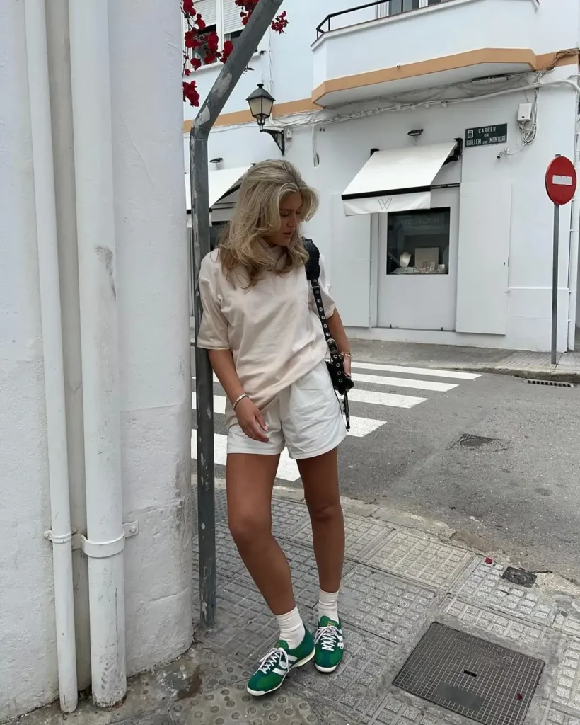  Oversized beige tee + white shorts + green Adidas SL 72