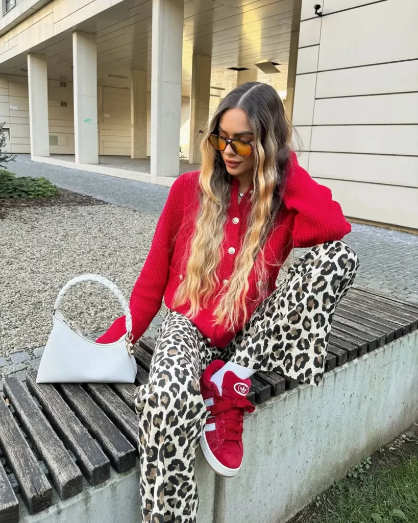 red Adidas Campus 00s that pop with energy and mirror the sweater’s vibrant hue