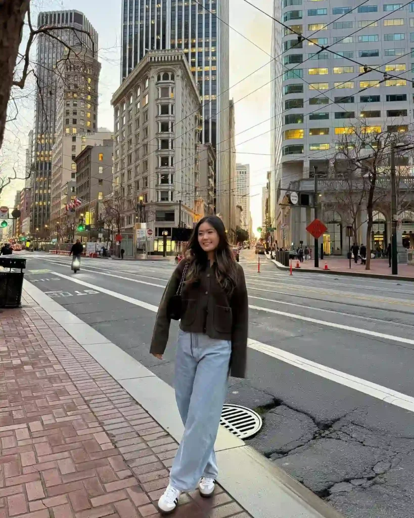 White Adidas Samba with Light Jeans and Cropped Knit Jacket