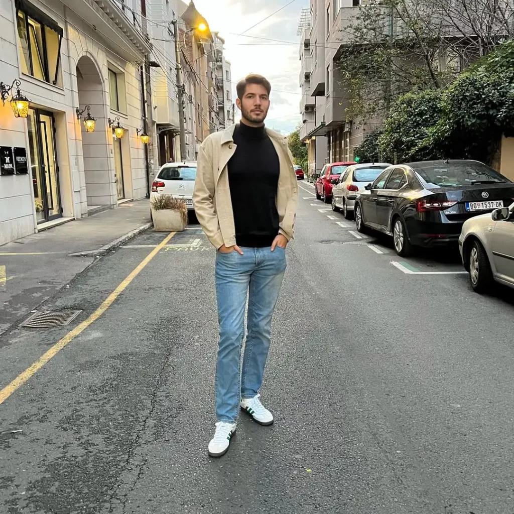 white Adidas Sambas with green stripes give the whole outfit a sporty, stylish kick.