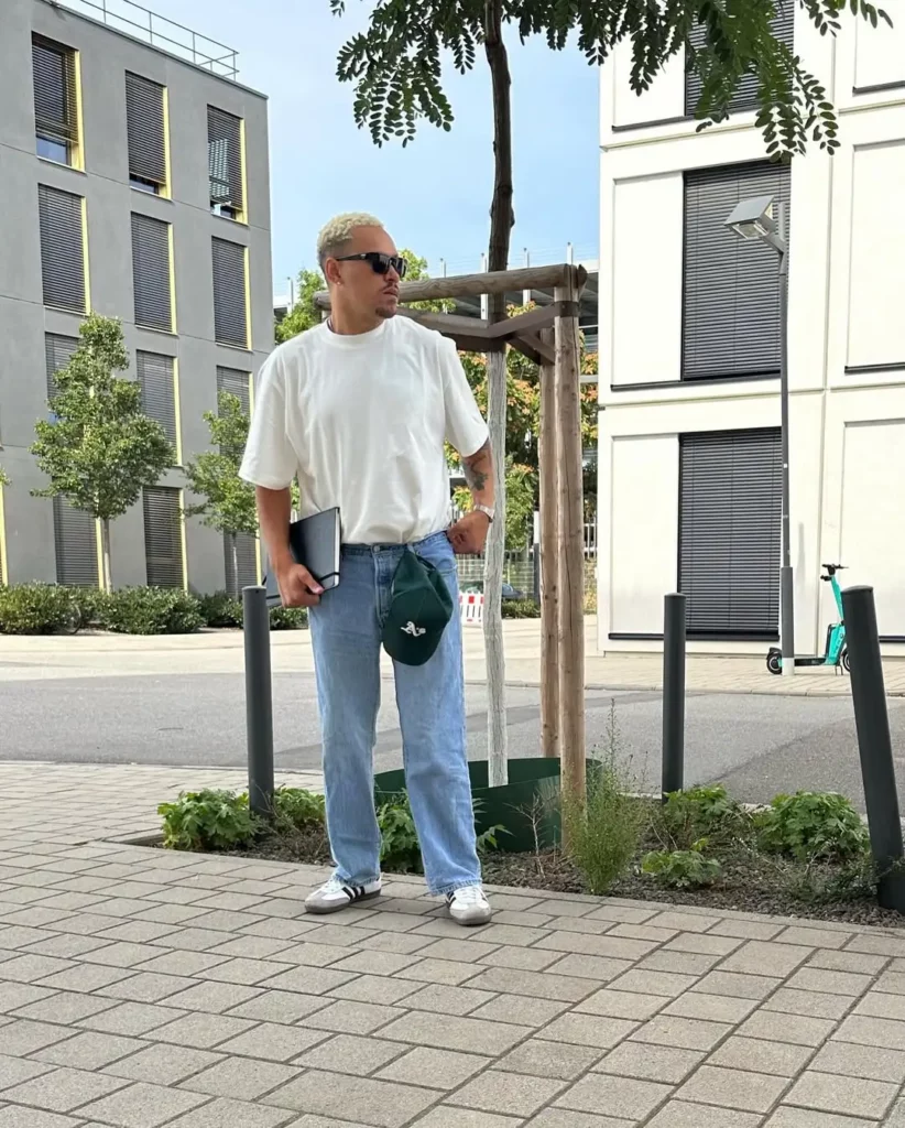 A crisp white tee and light-wash jeans are as timeless as it gets. The Adidas Sambas fit right in, grounding the look with heritage cool.