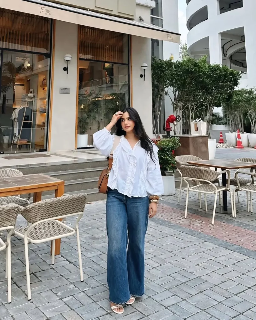 White Ruffle Blouse + Wide-Leg Jeans + White Flat Sandals