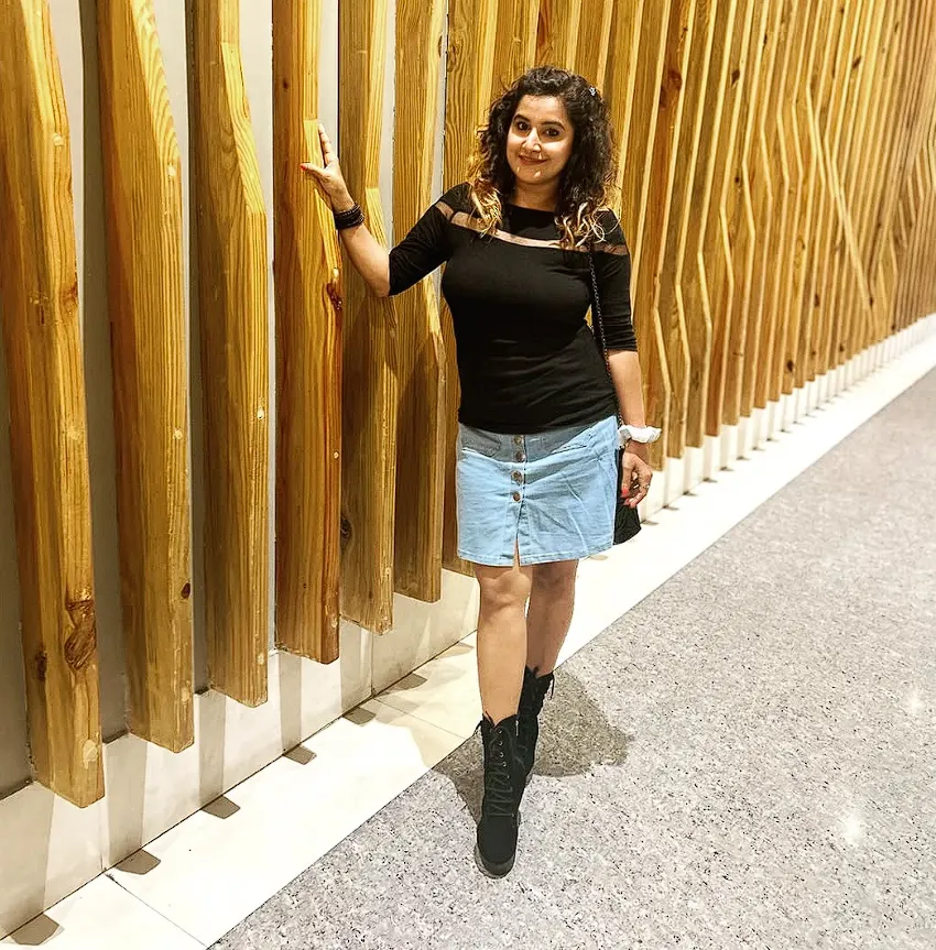 Black Top + Button-Front Denim Skirt + Lace-Up Ankle Boots