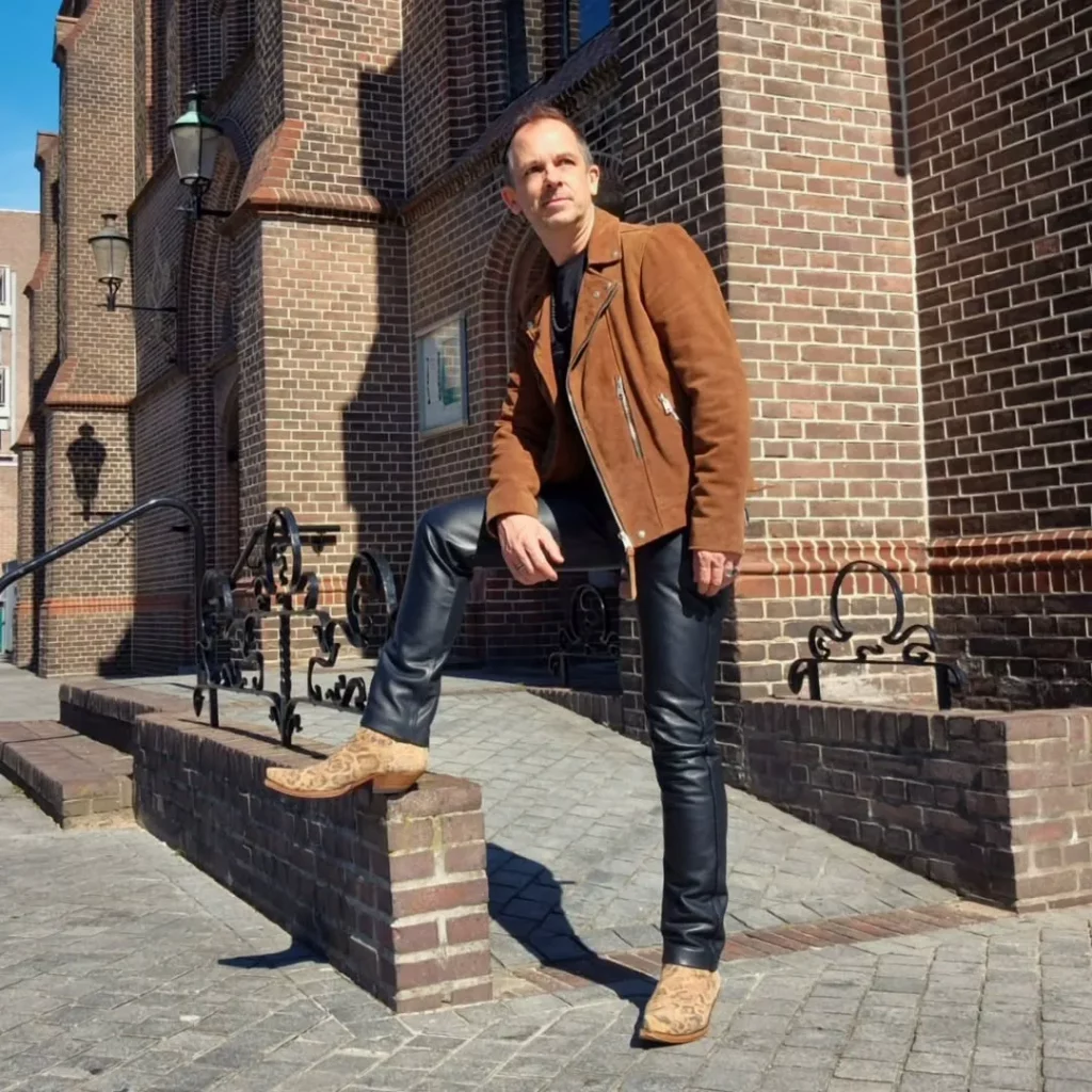 Brown Suede Jacket + Black Leather Pants + Patterned Cowboy Boots