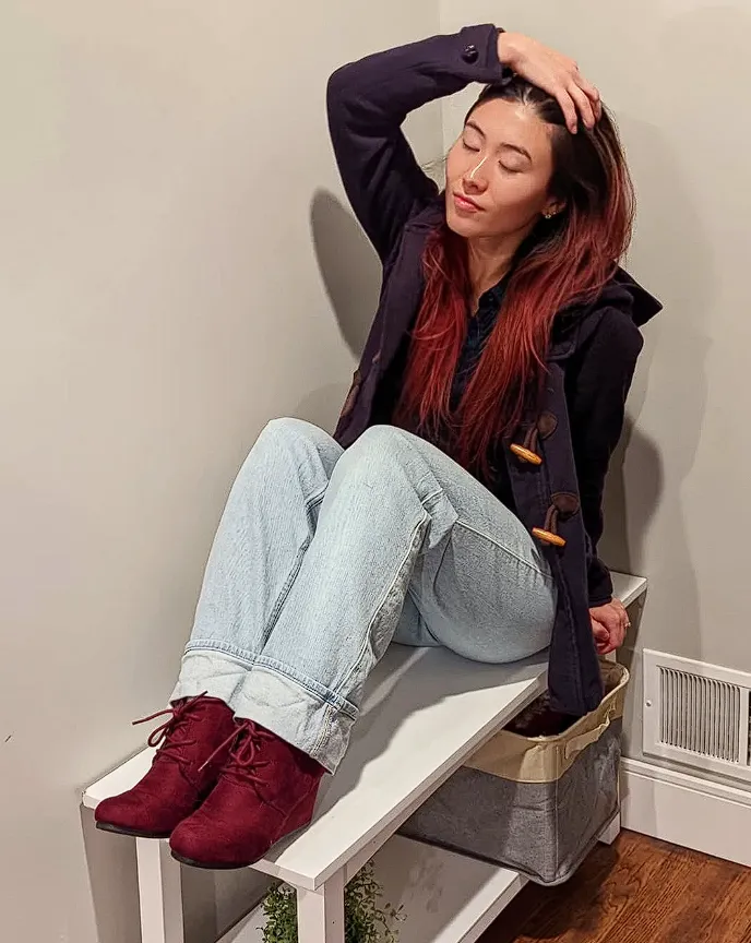 Burgundy Lace-Up Ankle Boots + Light-Wash Denim + Navy Coat