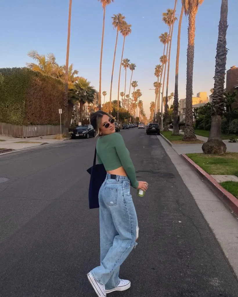 Cropped Long Sleeve + Baggy Ripped Jeans + White Low-Top Converse