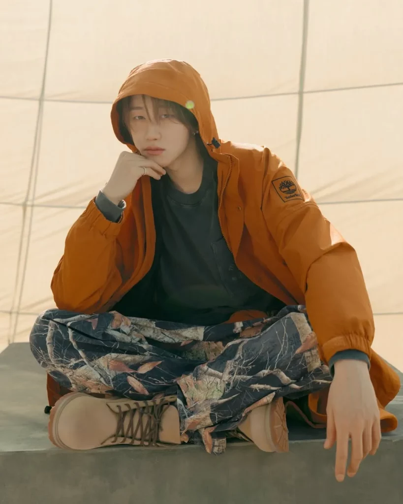 Orange Windbreaker with Camo Pants and Timberland Boots