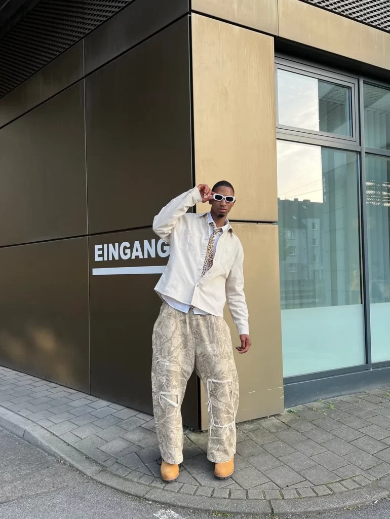 White Shirt with Wide-Leg Pants and Timberland Boots