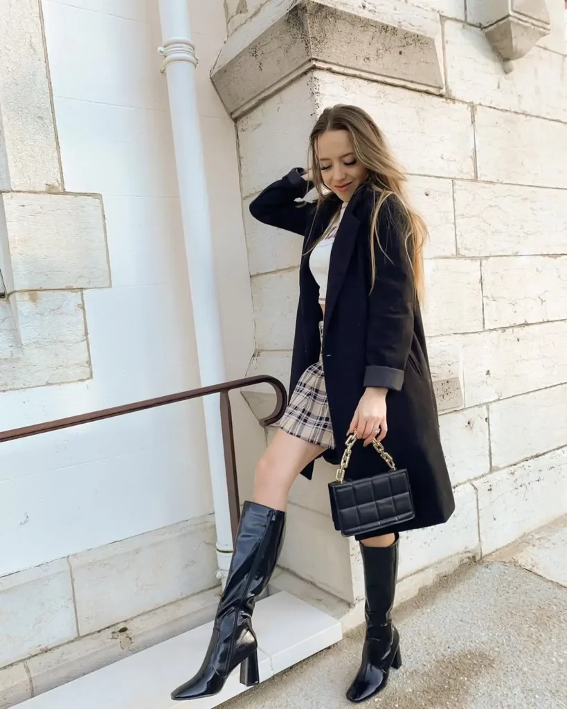 The plaid mini skirt adds a touch of playfulness, while the white top keeps things clean and simple.