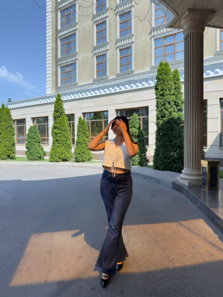 Sunlit Street Style with Bootcut Jeans & Heels