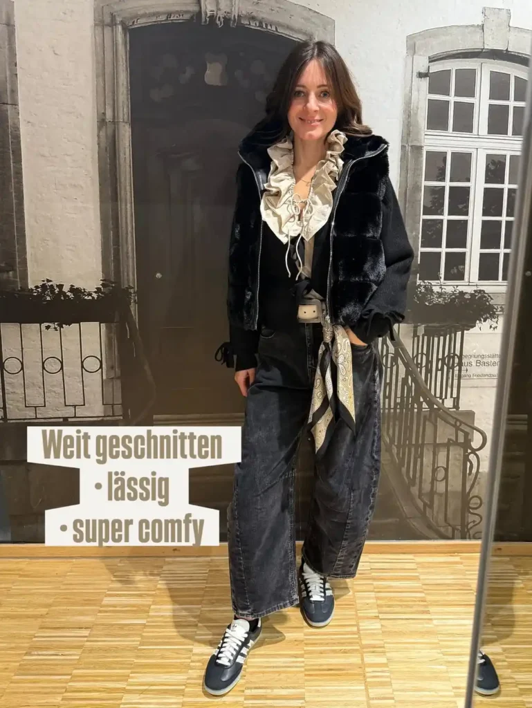 Relaxed Dark Denim Style with Barrel Jeans and Sneakers