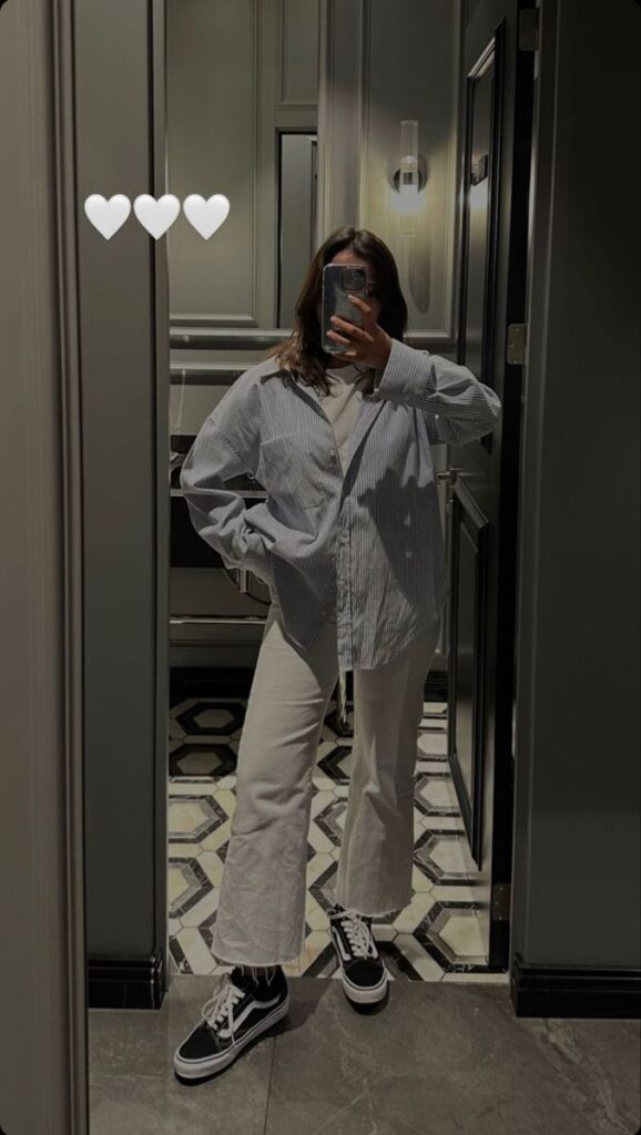 Oversized Striped Shirt with Cream Wide-Leg Jeans and Classic Vans