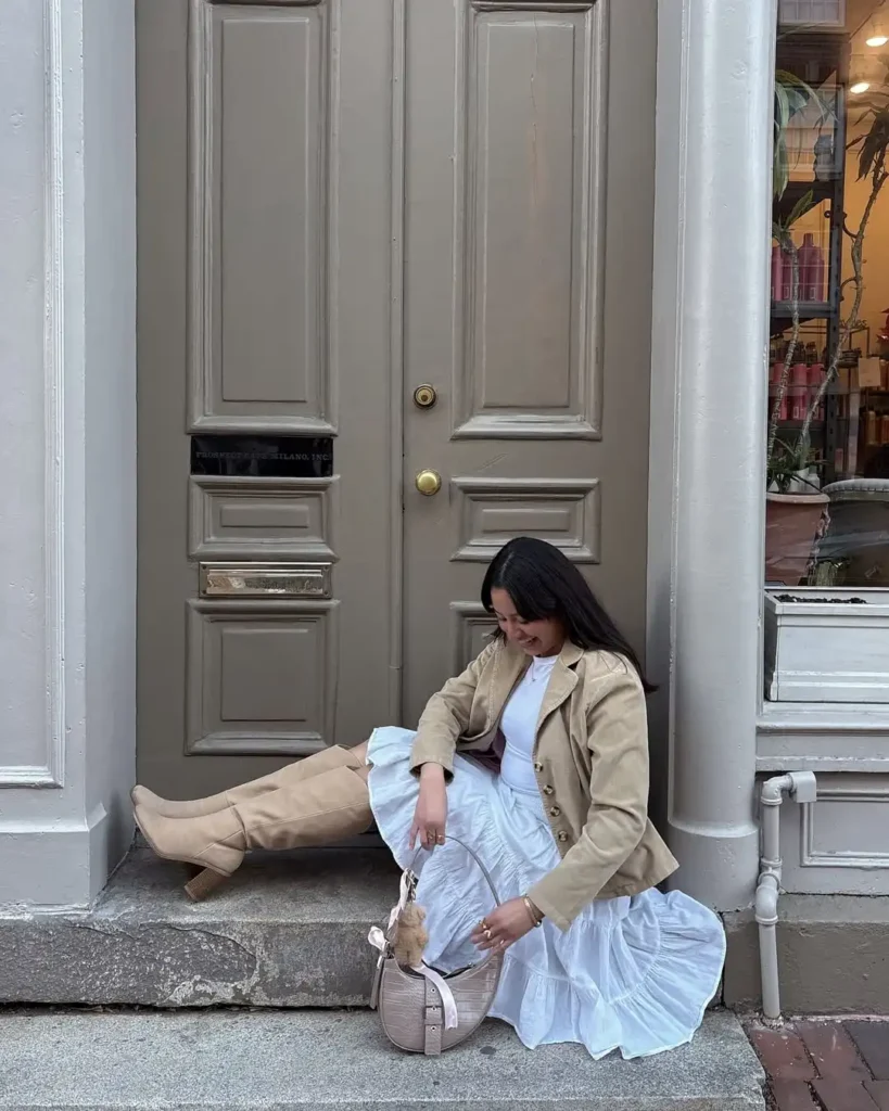 Soft City Spring Outfit with Boots and Flowy Skirt