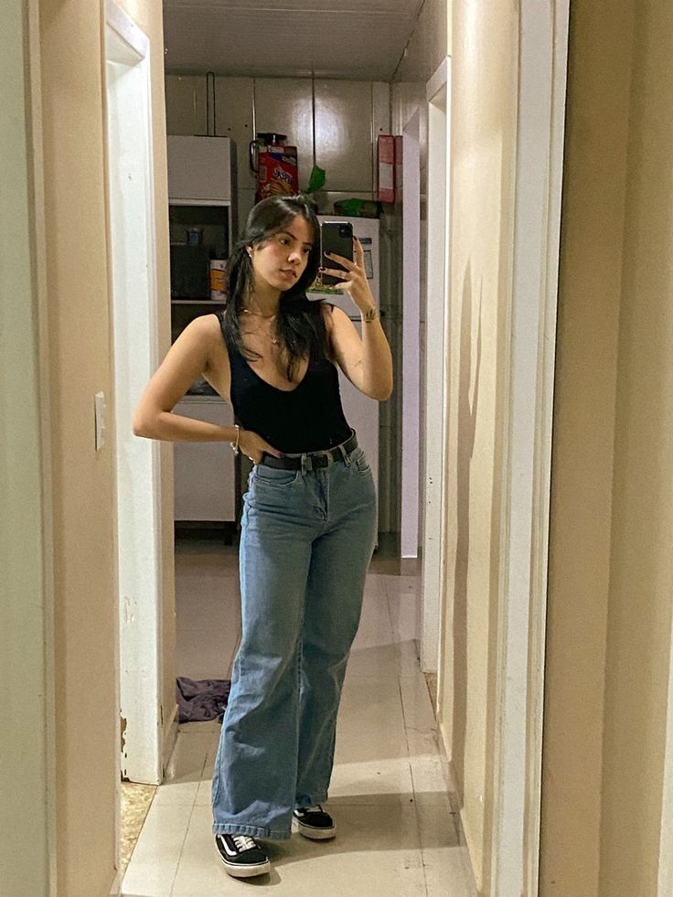 Black Bodysuit with Light-Wash Wide-Leg Jeans and Classic Vans