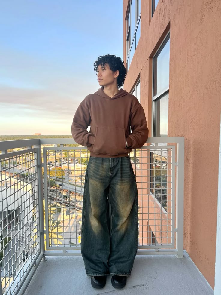 Brown Hoodie with Dark Baggy Jeans and Black Boots
