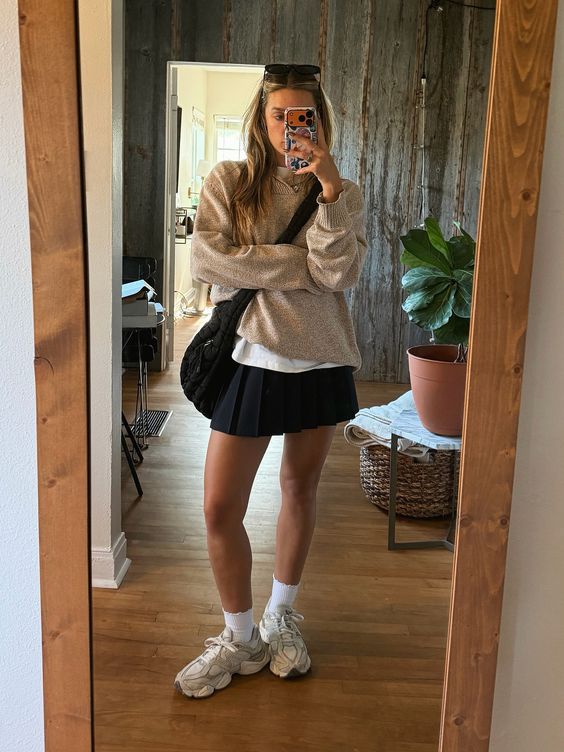 Neutral Sweater and Black Pleated Skirt with New Balance 9060