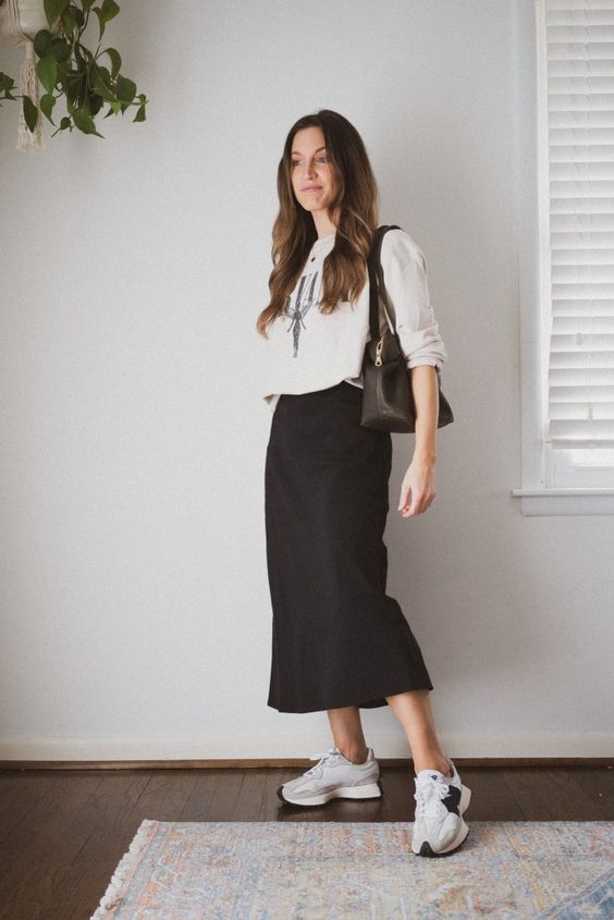 Graphic Sweatshirt with Black Midi Skirt and New Balance 327 Outfit