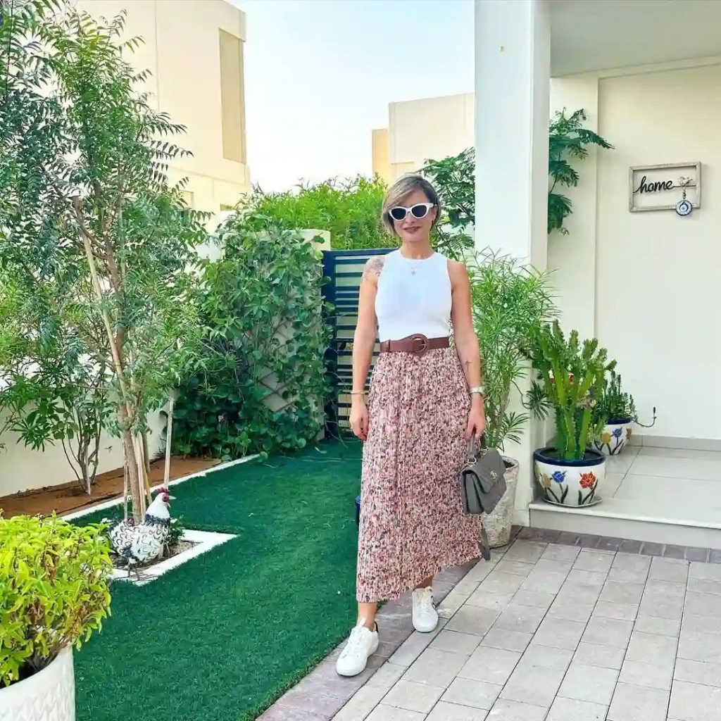 Floral Pleated Midi Skirt with Sleeveless Top and Sneakers Outfit