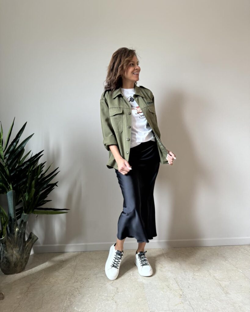 Utility Jacket with Black Satin Skirt and Sneakers