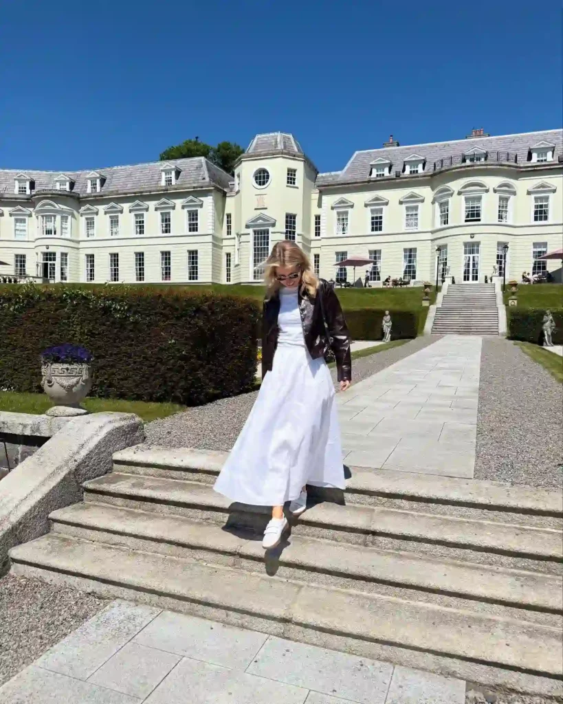 White Maxi Skirt with Leather Jacket and Sneakers Outfit