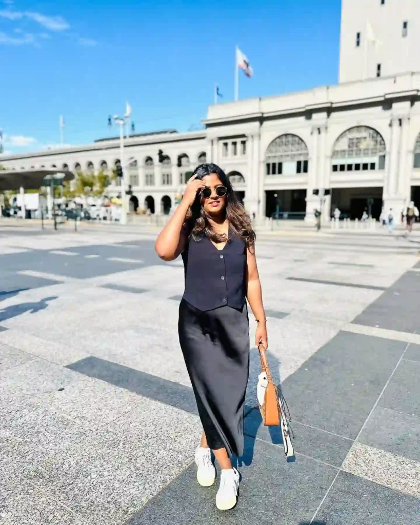 Sleeveless Black Top with Satin Skirt and Sneakers