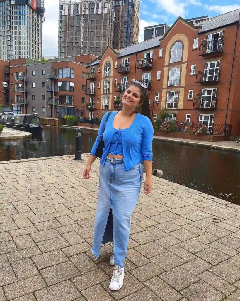 Blue Cardigan with Light Denim Midi Skirt and Sneakers