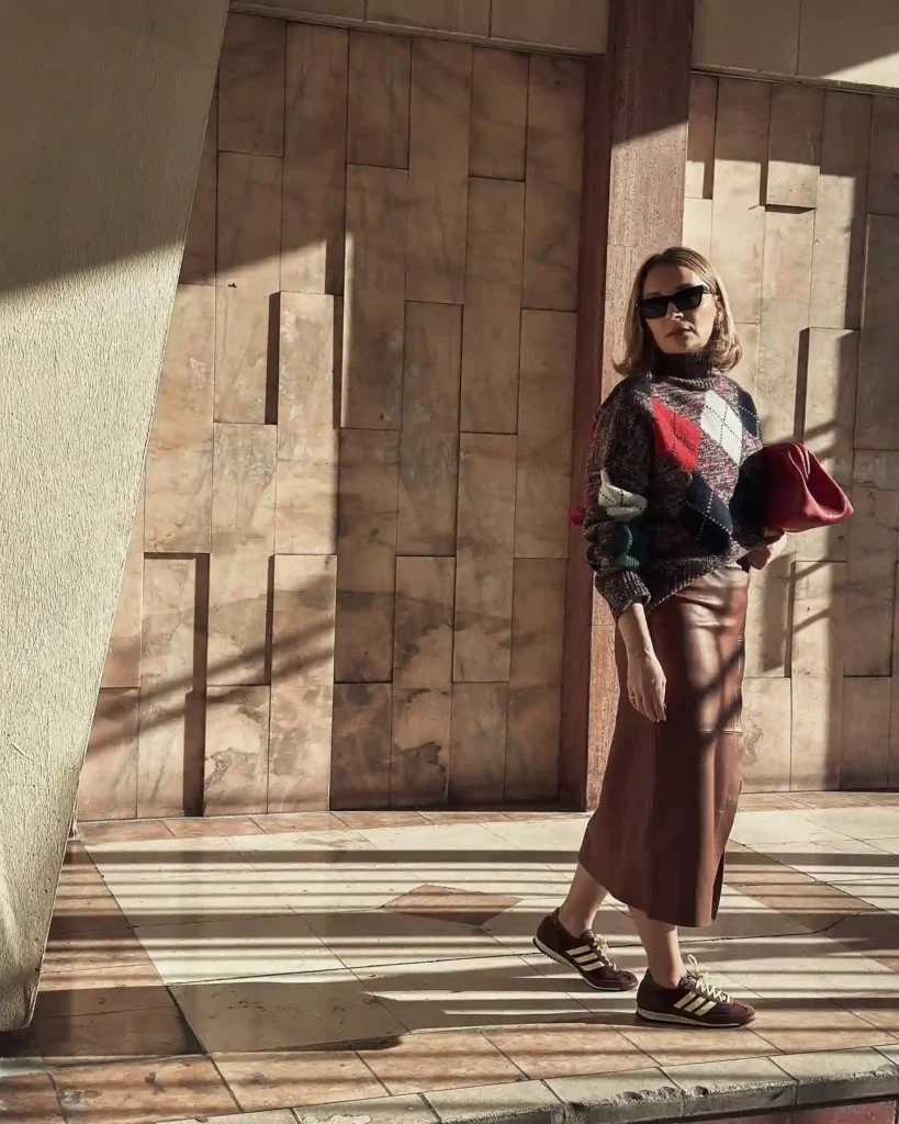 Knit Sweater with Brown Leather Midi Skirt and Sneakers Outfit