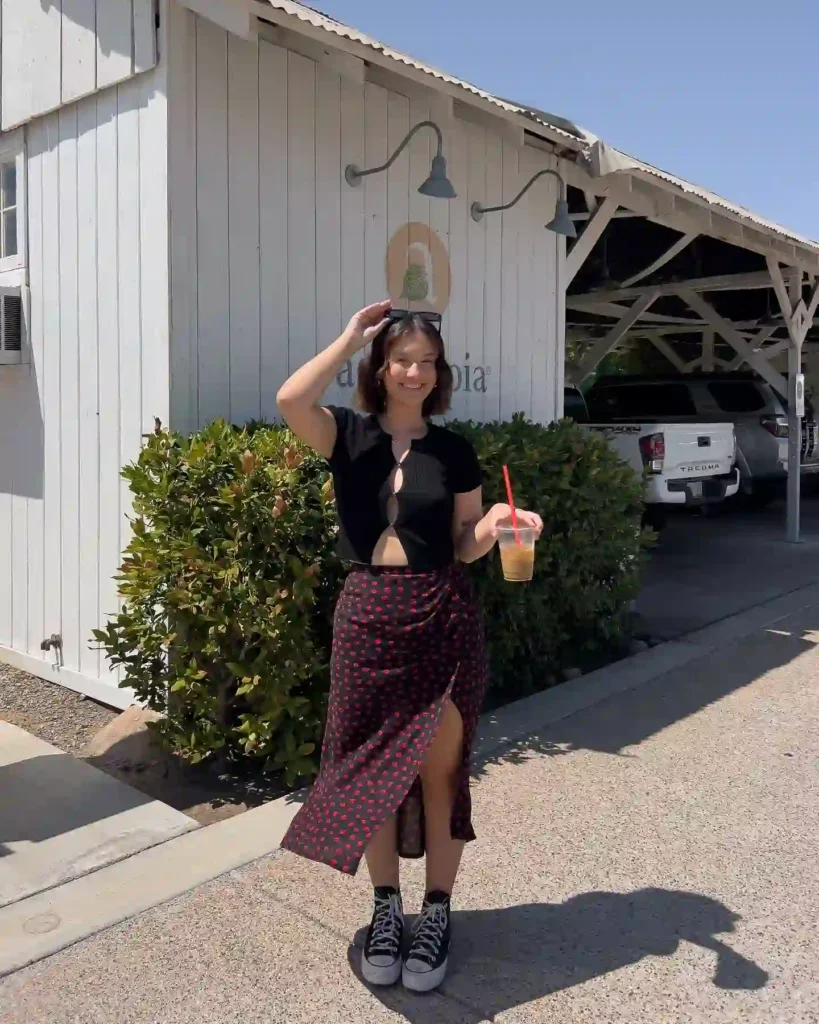 Black Cut-Out Top with Printed Midi Skirt and Sneakers Outfit
