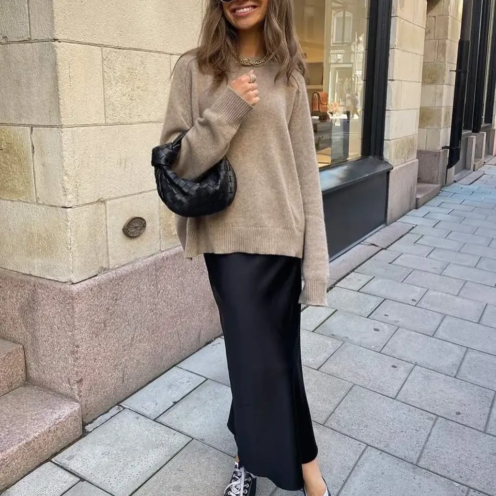 Cozy Knit Sweater with Black Satin Skirt and Sneakers