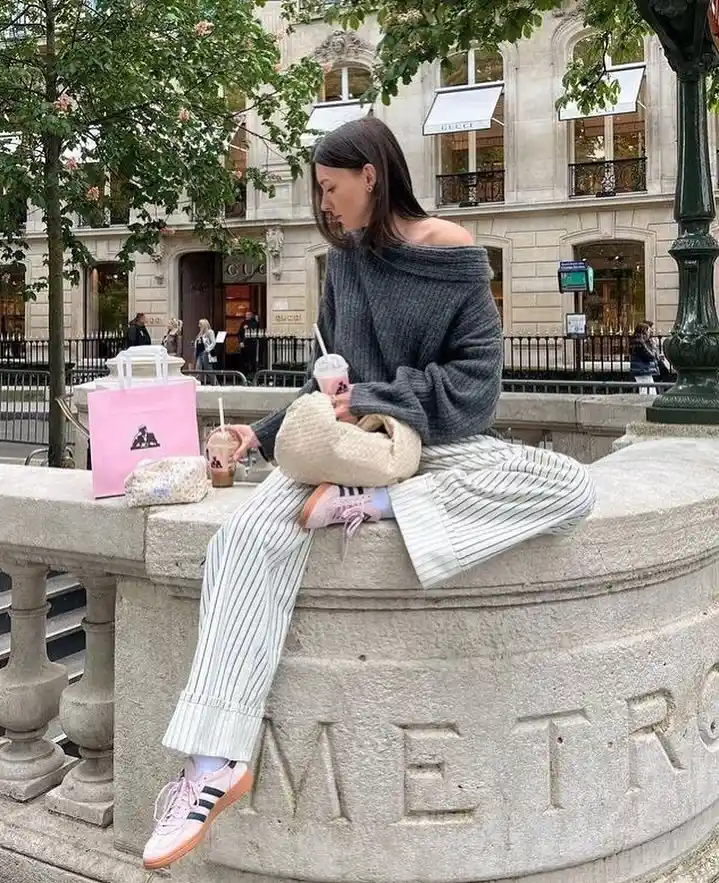 Off-Shoulder Knit Sweater with Striped Pants and Pink Adidas Handball Spezial