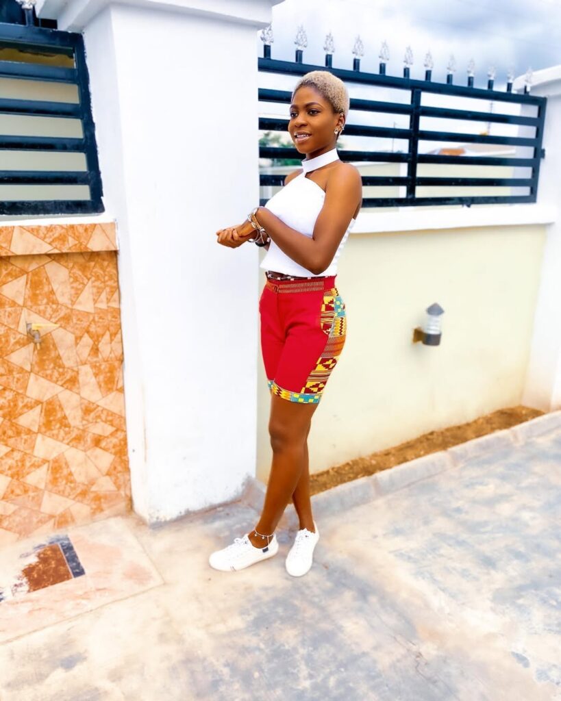 White Halter Top with Printed Red Shorts and White Sneakers
