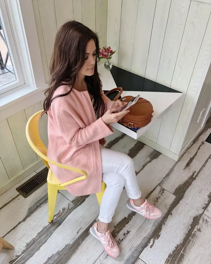 Pink Cardigan with White Jeans and Pink New Balance Shoes