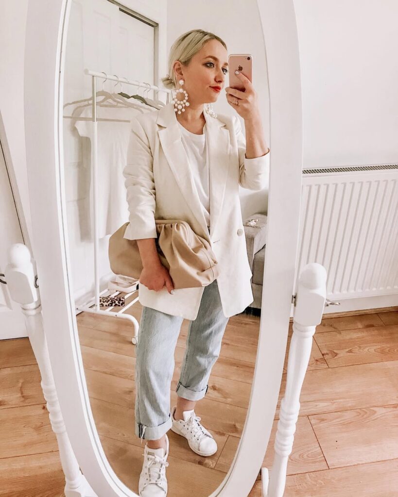White Blazer with Rolled Jeans and White Sneakers