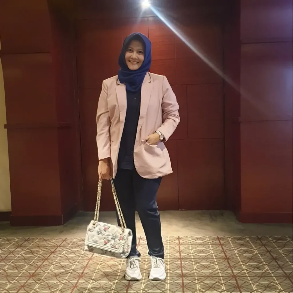 Light Pink Blazer with Dark Pants and Sneakers Outfit