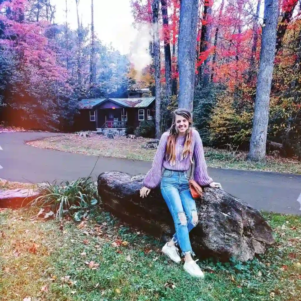 Lavender Sweater with Ripped Jeans and White Sneakers