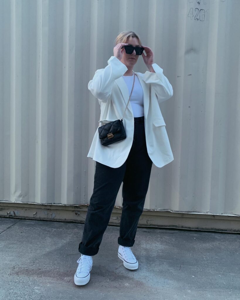 Oversized White Blazer with Black Jeans and White Sneakers