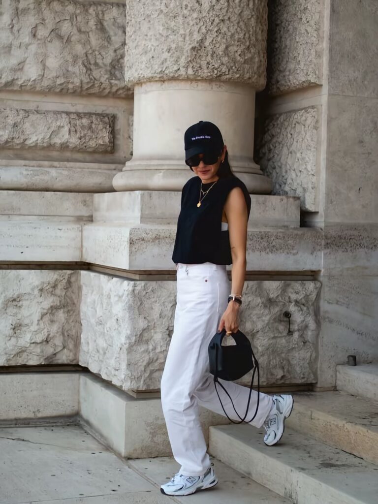 Black Sleeveless Top with White Pants and New Balance 530 Outfit