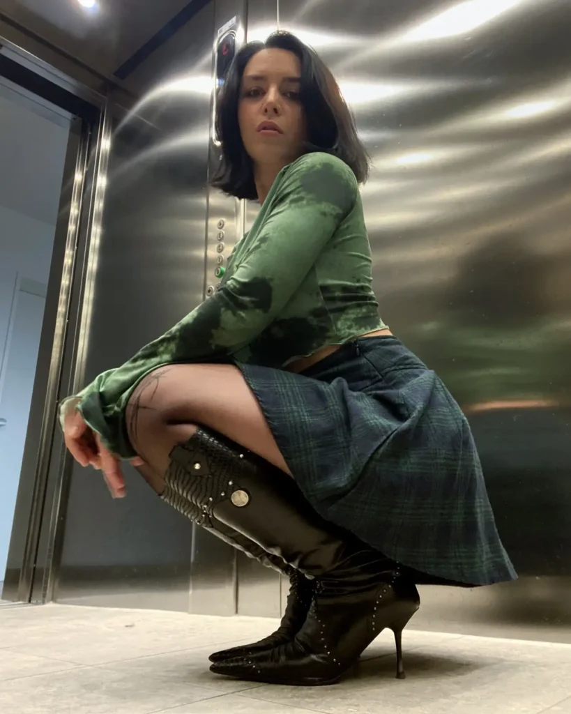 Green Velvet Top with Plaid Skirt and Heeled Boots