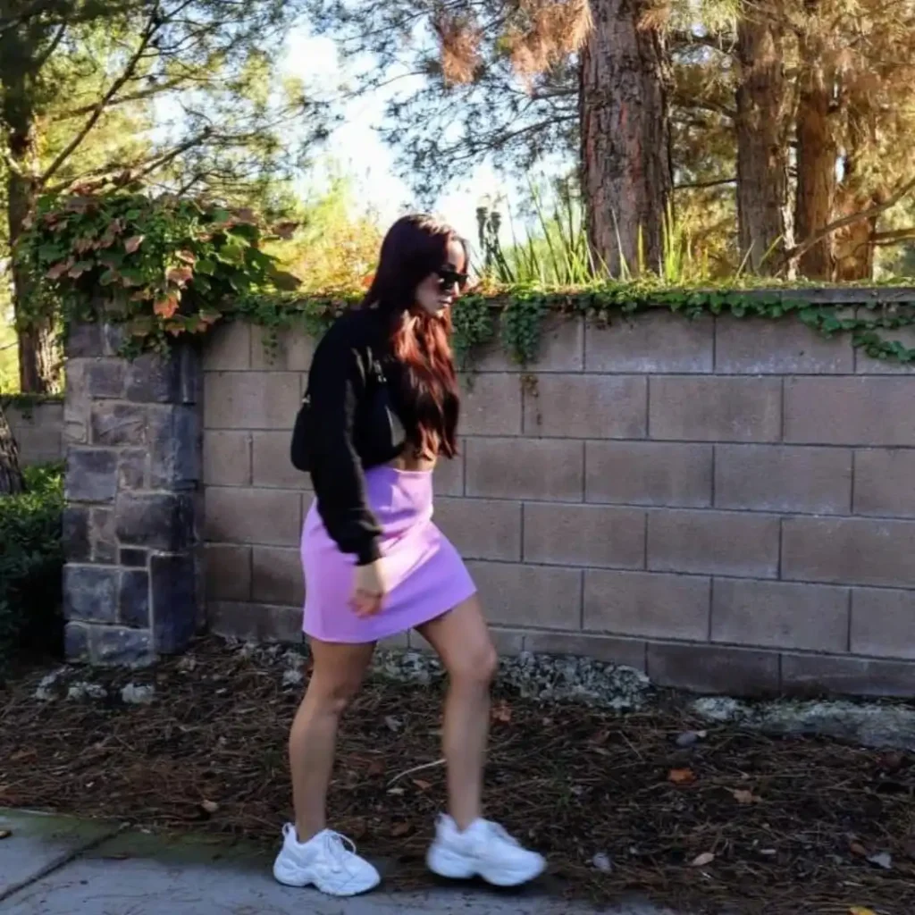 Black Cropped Sweatshirt with Purple Mini Skirt and White Chunky Sneakers