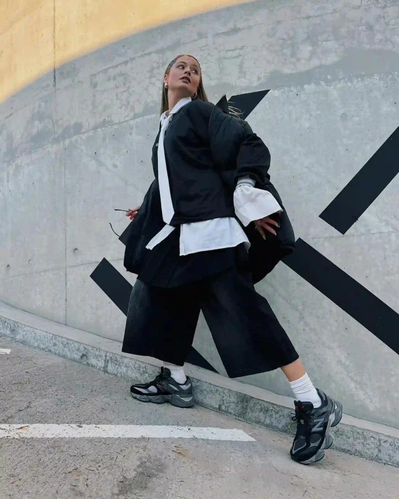 Black Puffer Jacket with Wide-Leg Shorts and Black New Balance Shoes